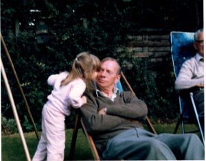 Little Carla in the garden with her grandad