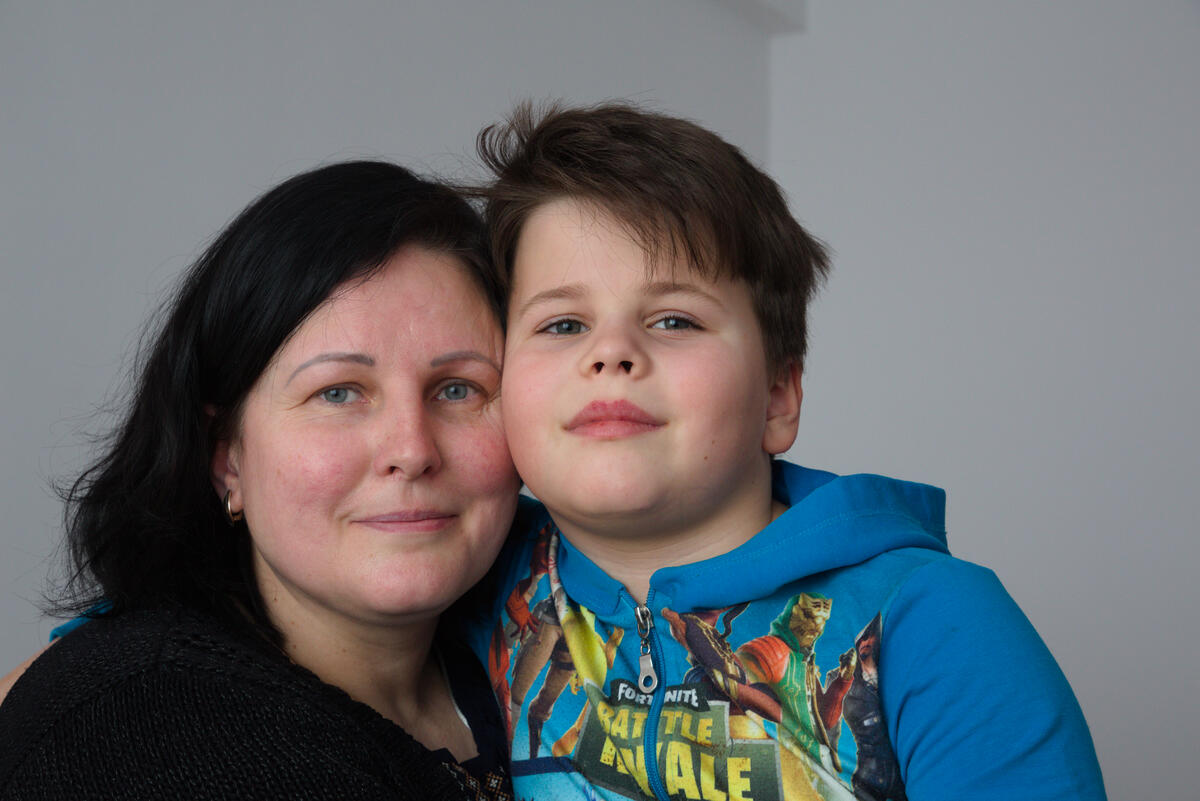 Julia, 45, with her son David in Ukrainian women's shelter in Bucharest