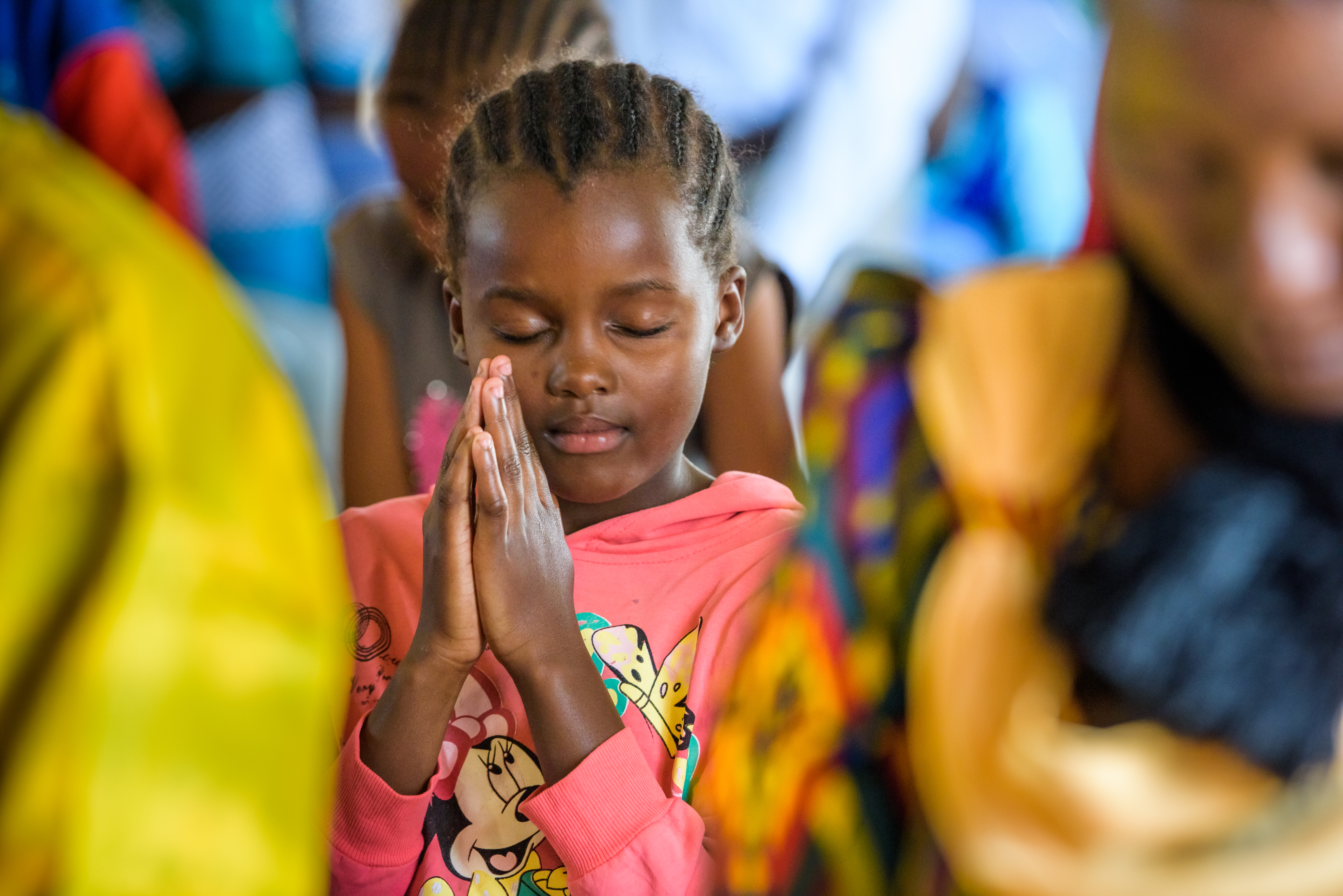 A girl from Kalawa AP, Kenya, praying