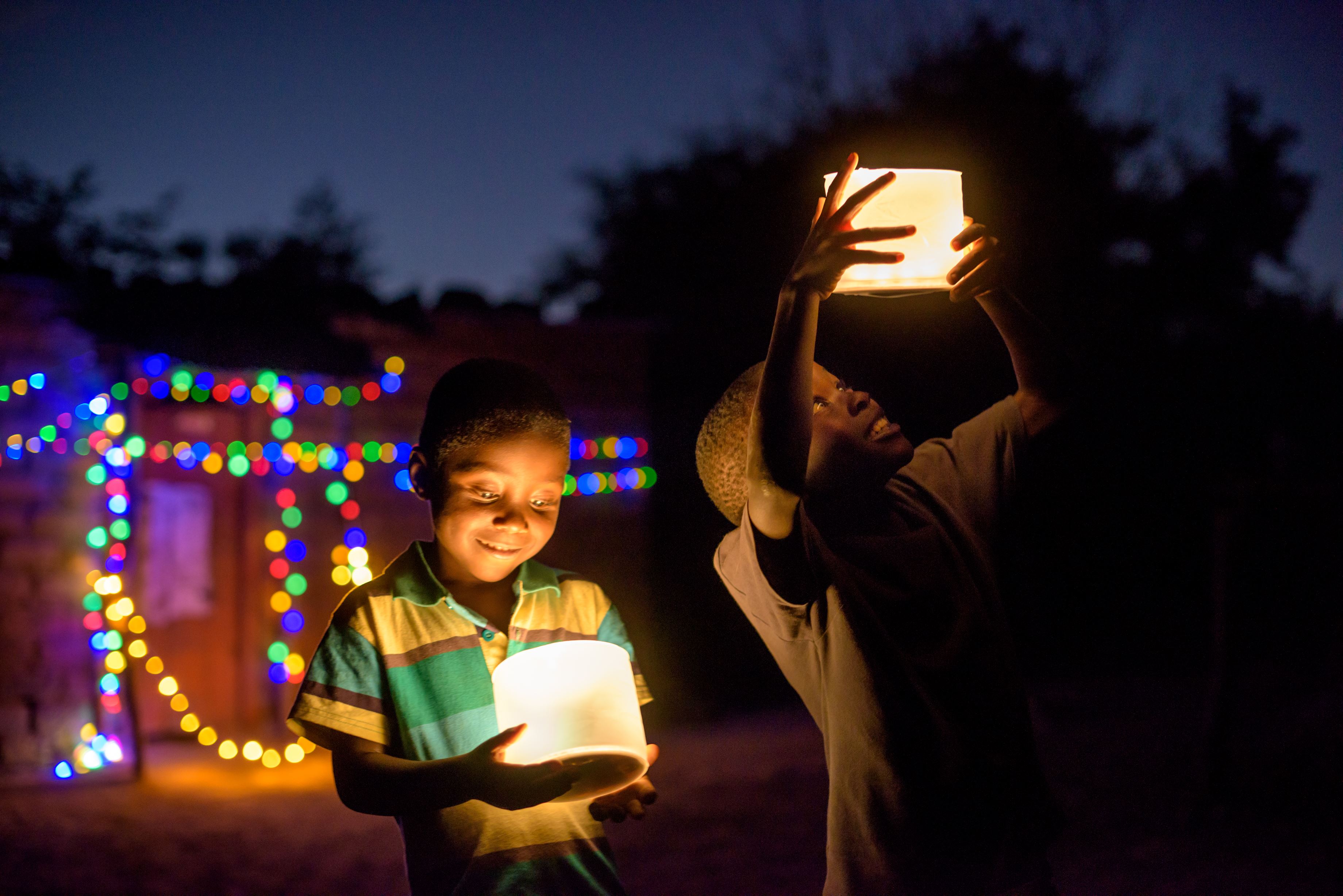 Sponsored boy Chansa, 5, (blue shirt) and his cousin, from Zambia, enjoy the Christmas lights at his grandparent's house