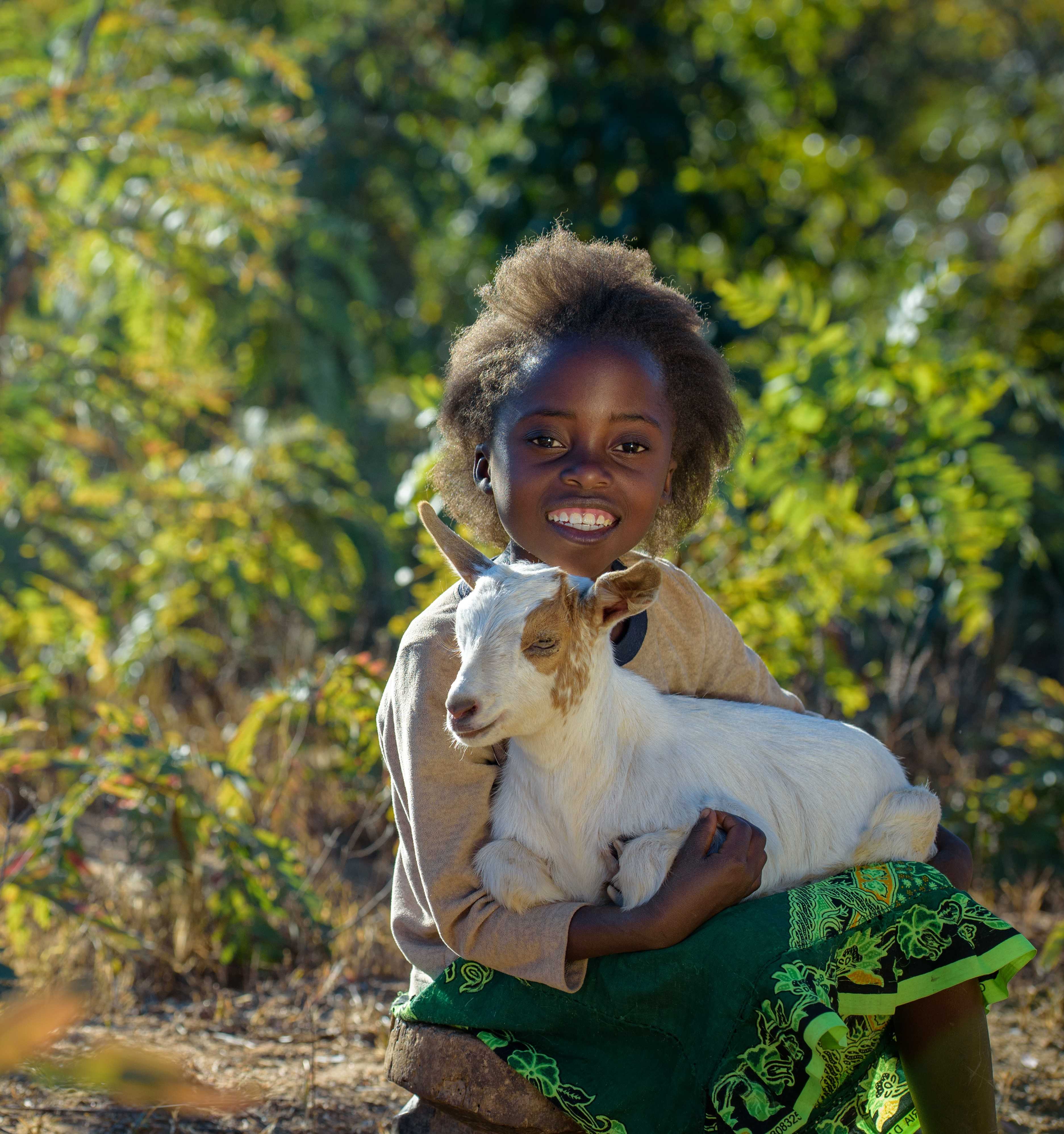 Sponsor girl holding a goat 