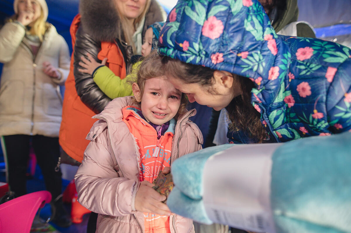 A child crying in a refugee camp