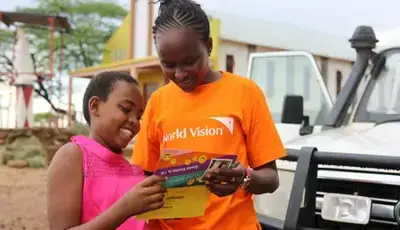 World vision staff and child