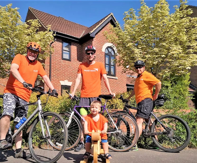Three MEn and one kid with Cycle