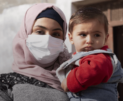 Young mother named Famtia holding her child 