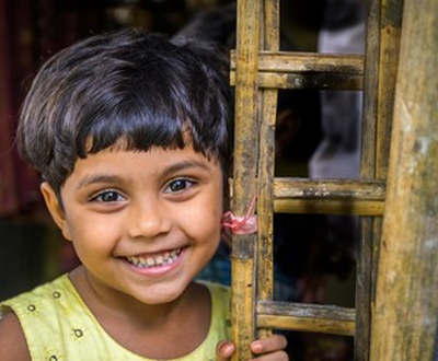 Girl smiles to the camera in Bangladesh
