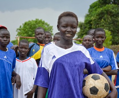 Kids are standing with football