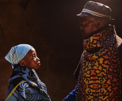 A father looking at his child- child marriage context.