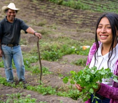 Nahomy helping her father in the field