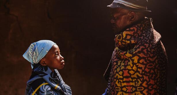 A father looking at his child- child marriage context.