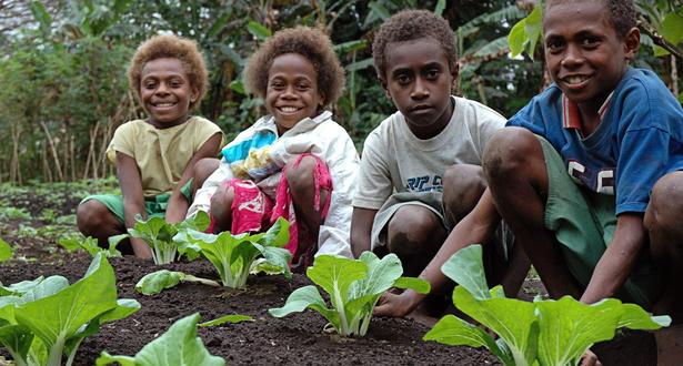 Petro, Wedo, Mary, and Mary from Lenaken middle school in Vanuatu looking after a school garden
