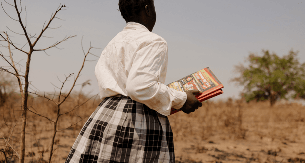 Brenda holding a book