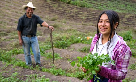 Nahomy helping her father in the field