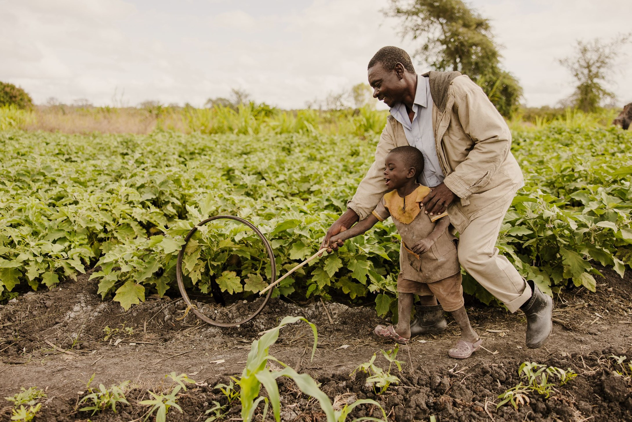 A father in Matope, Malawi, plays with his young son.