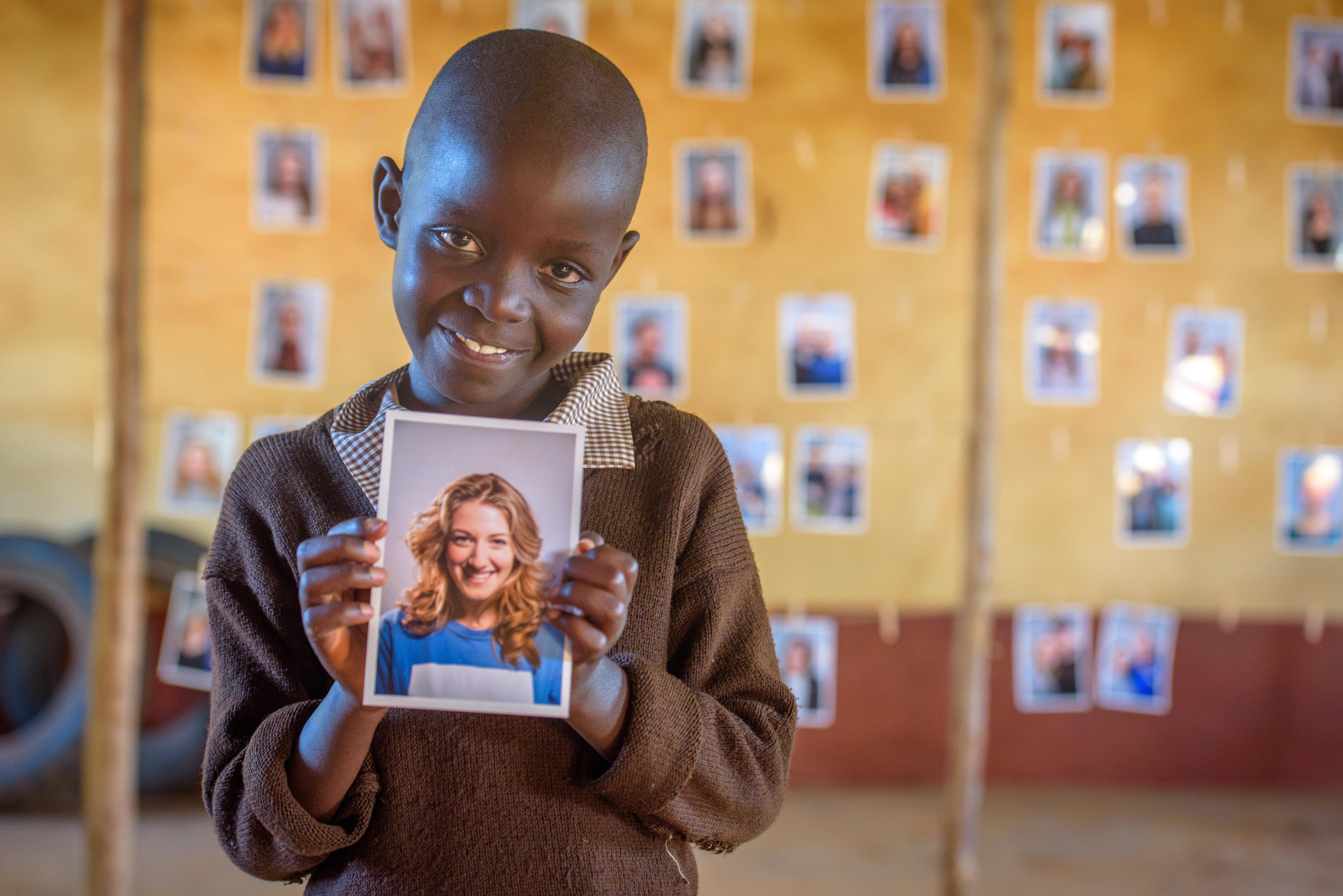 Elizabeth holding picture of Amanda