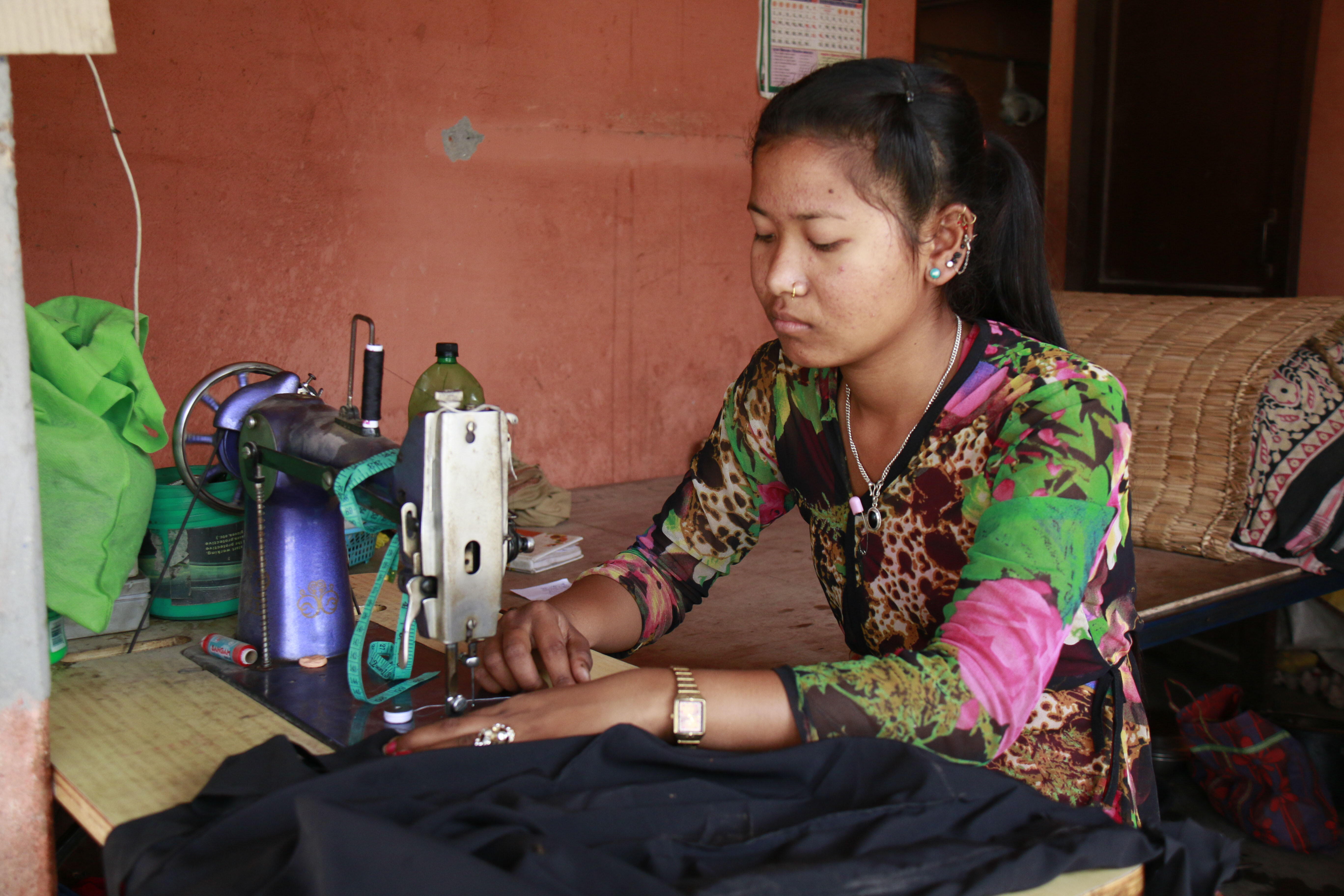 Kabita using sewing machine