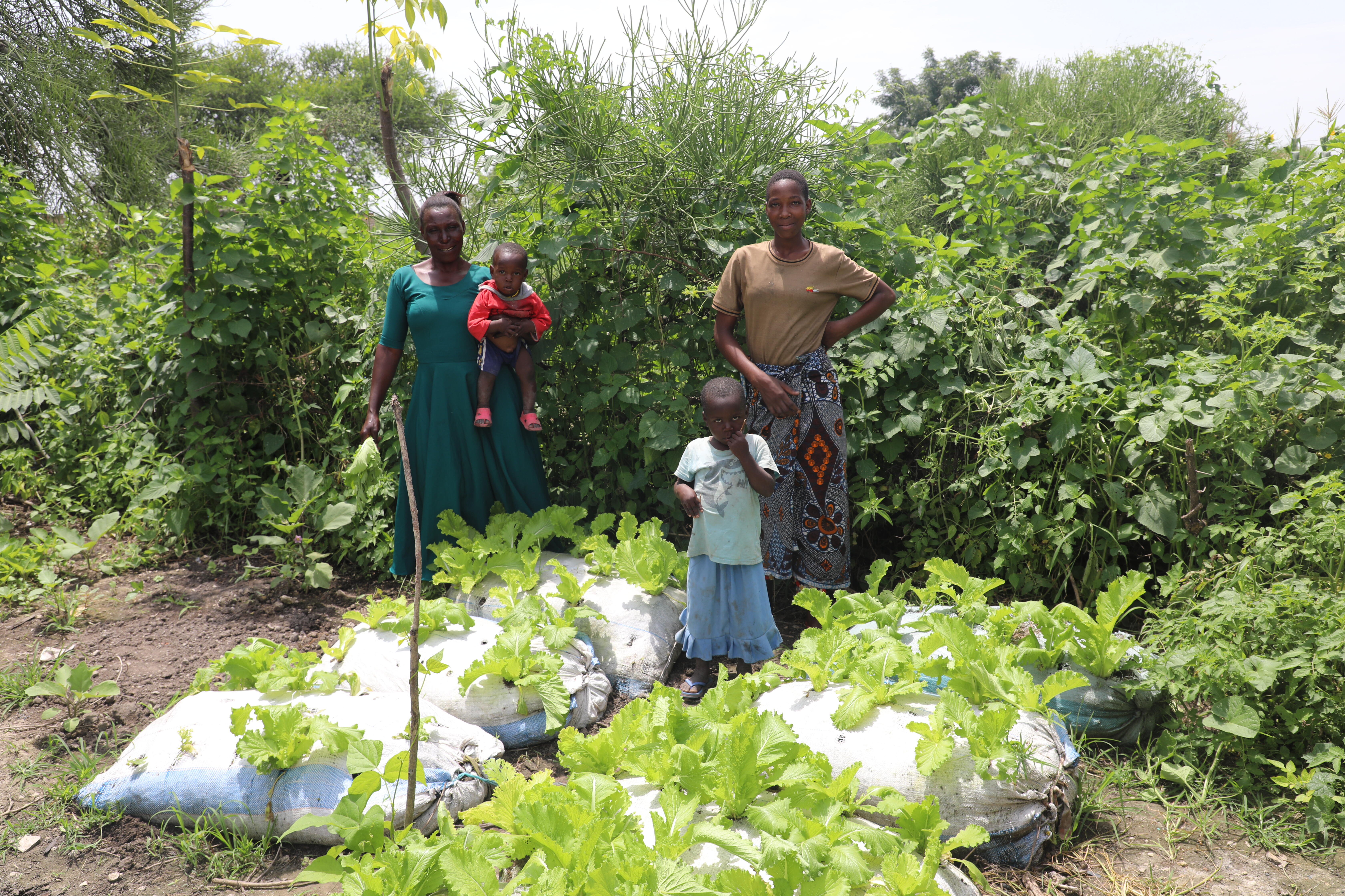 Juliana's family in the vegetable garden.