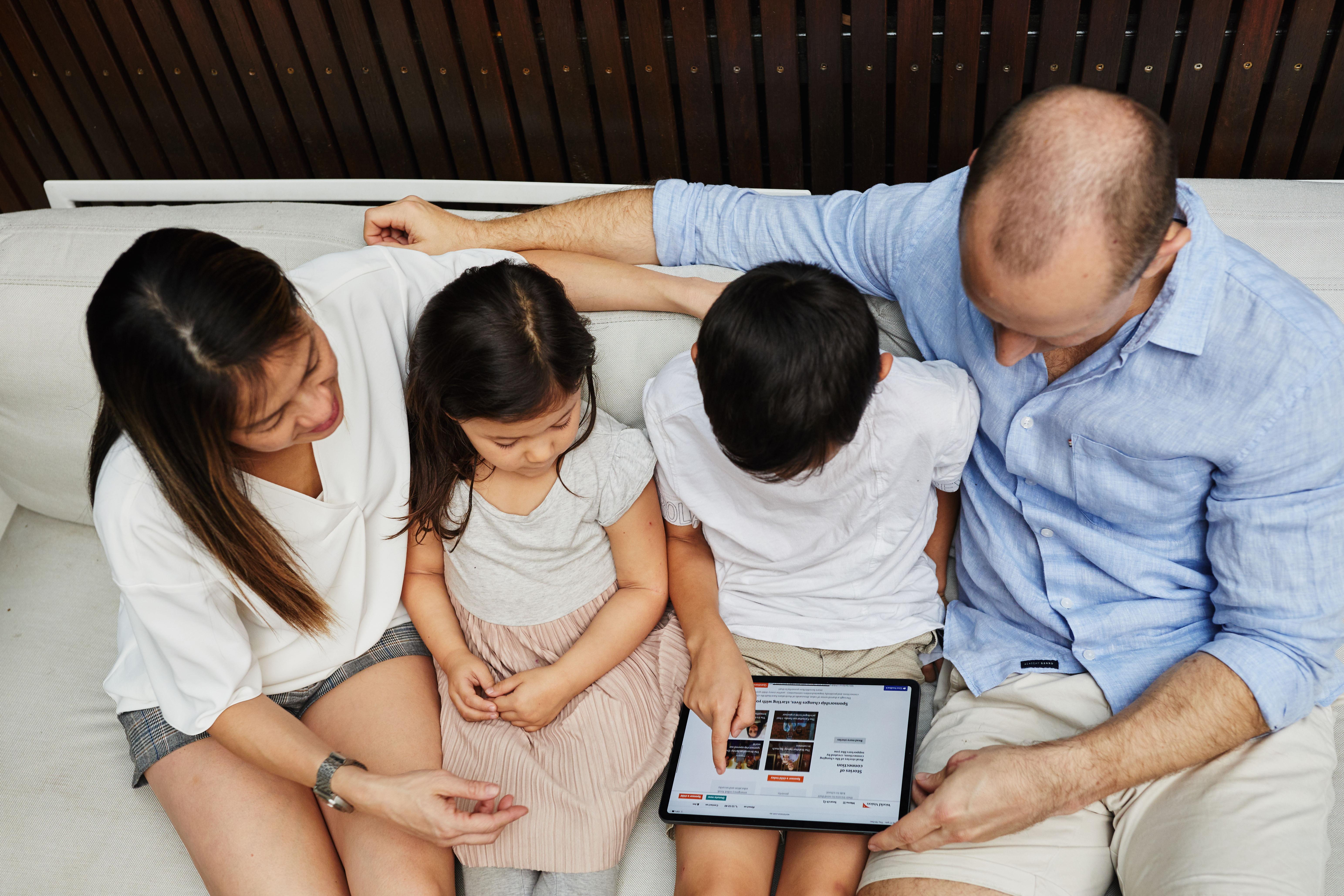 Family looking at world vision website