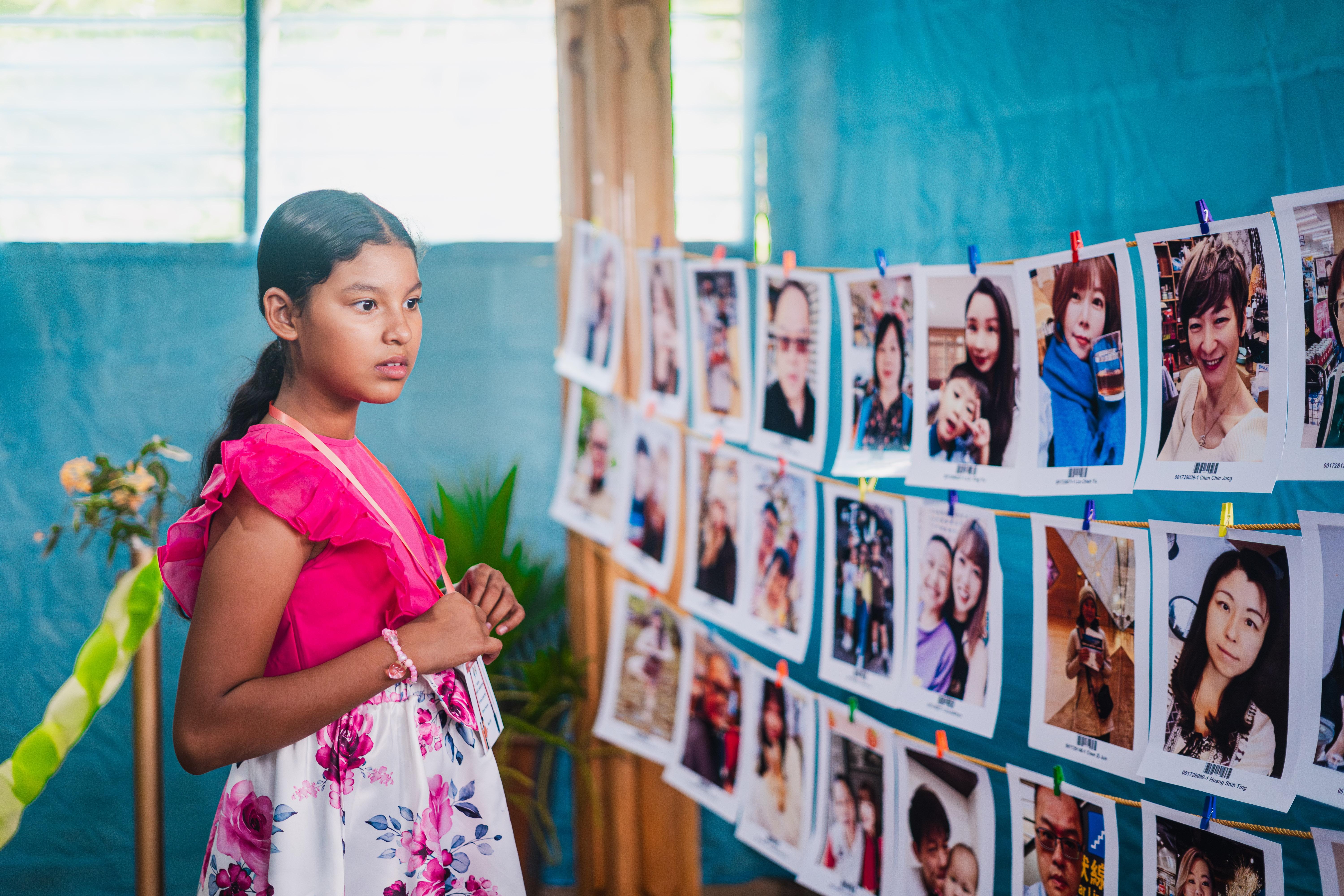 Girl looking at images of sponsors
