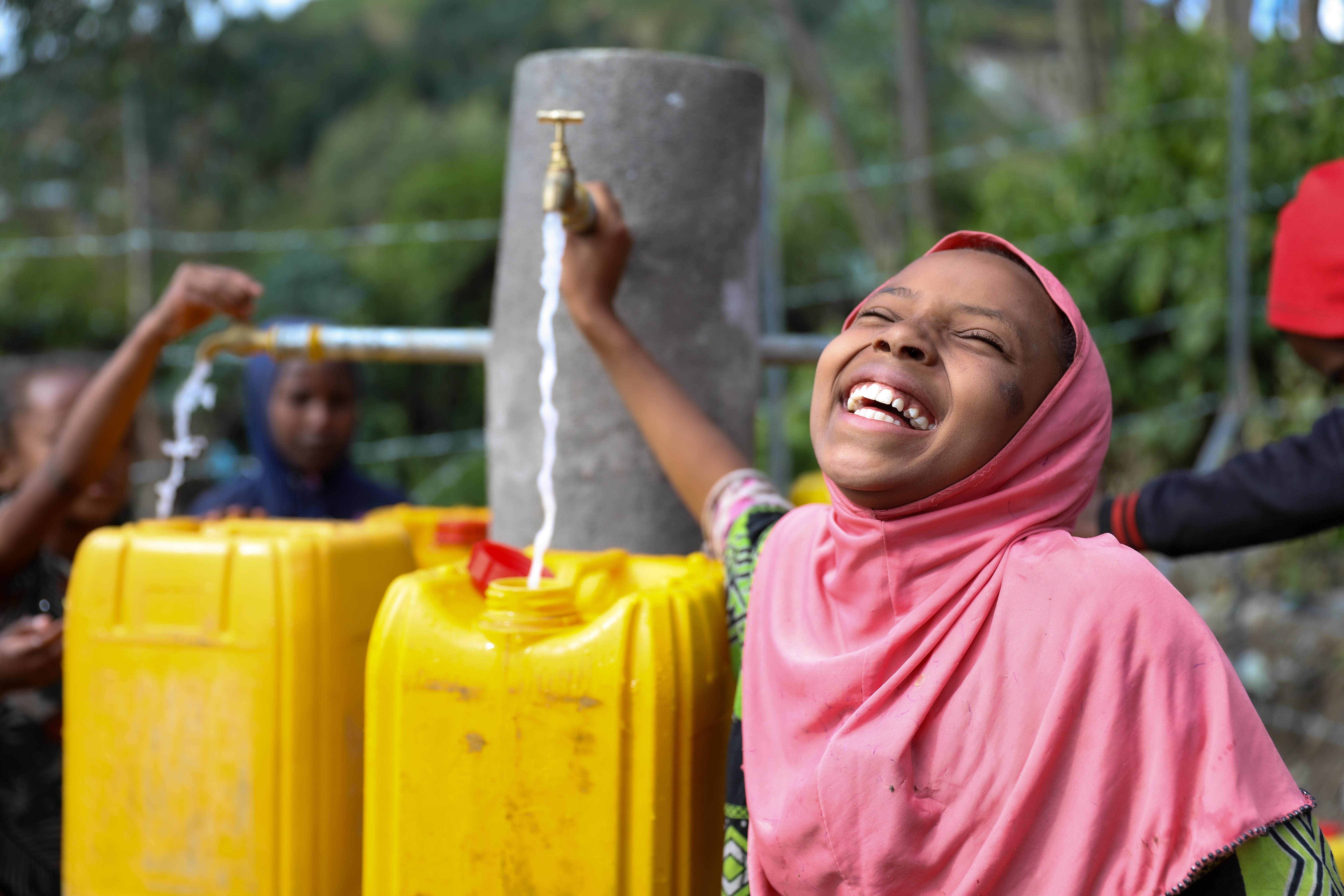 Sitina smiling at the water point