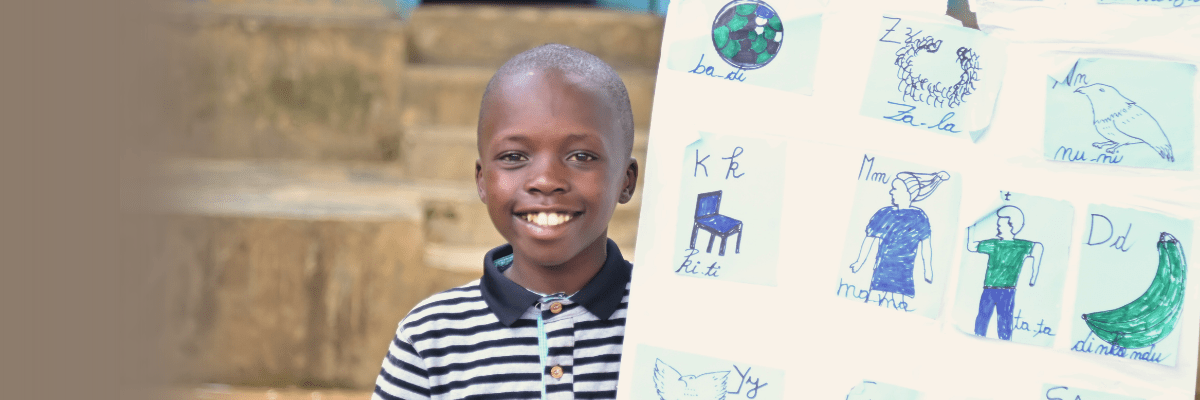 C’est Prévu smiling band holding school work