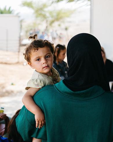 mother carrying her child