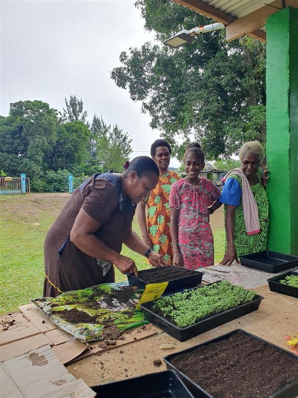 Agnes and other community members involved in NOURISH training