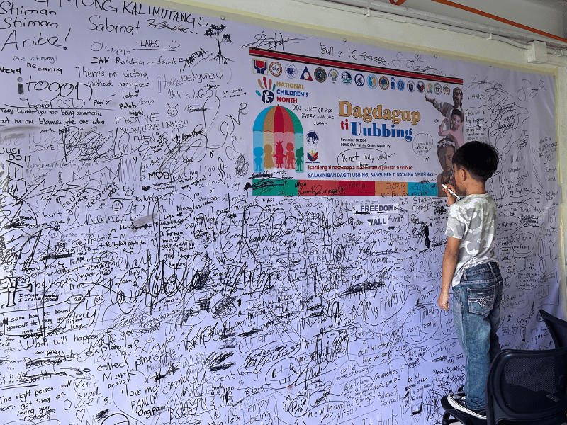 Child writing on paper