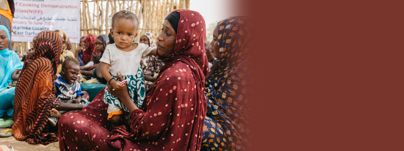 Sudanese mother holding her child