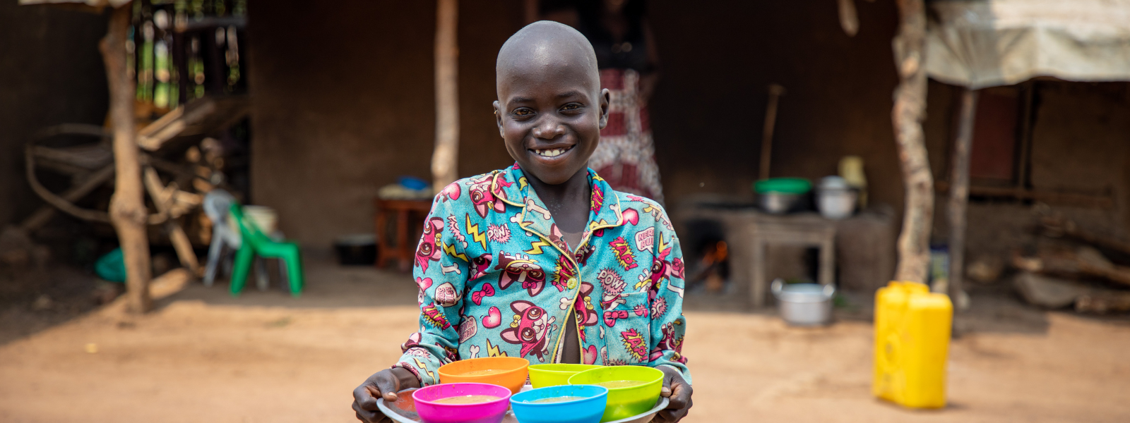 Child holding plate of food