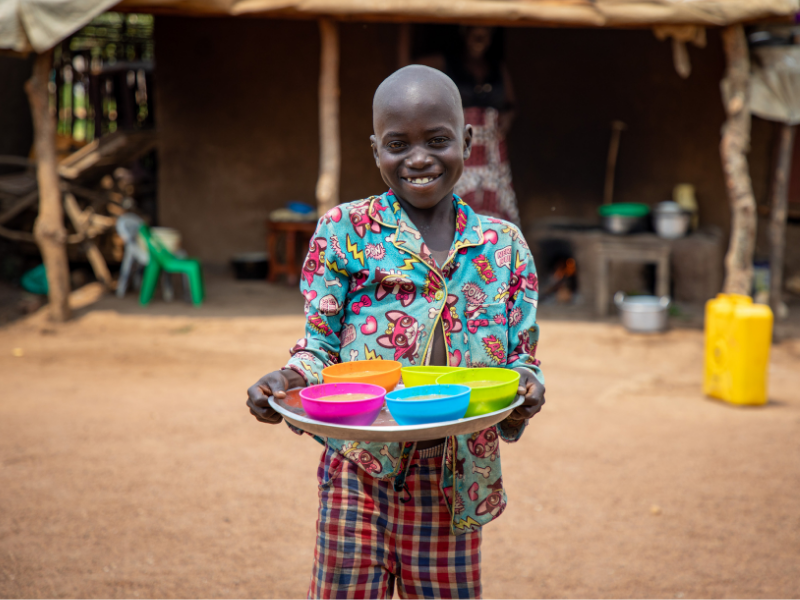 child holds plate of food
