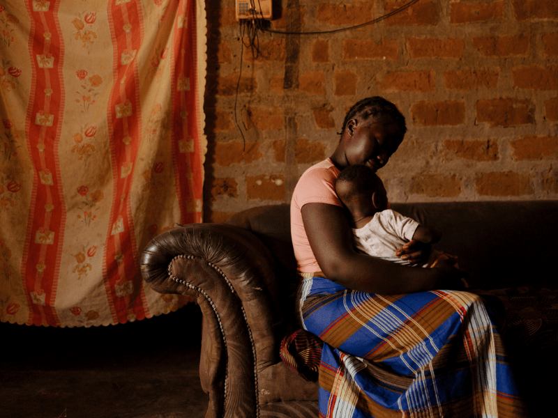 Brenda holding Joseph at home