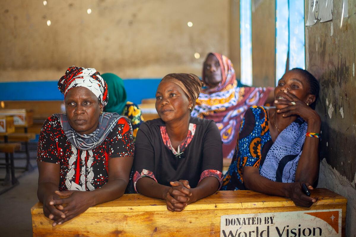 Image displays a focus group of older women taking part in the climate risk and vulnerability assessment in Tanzania.
