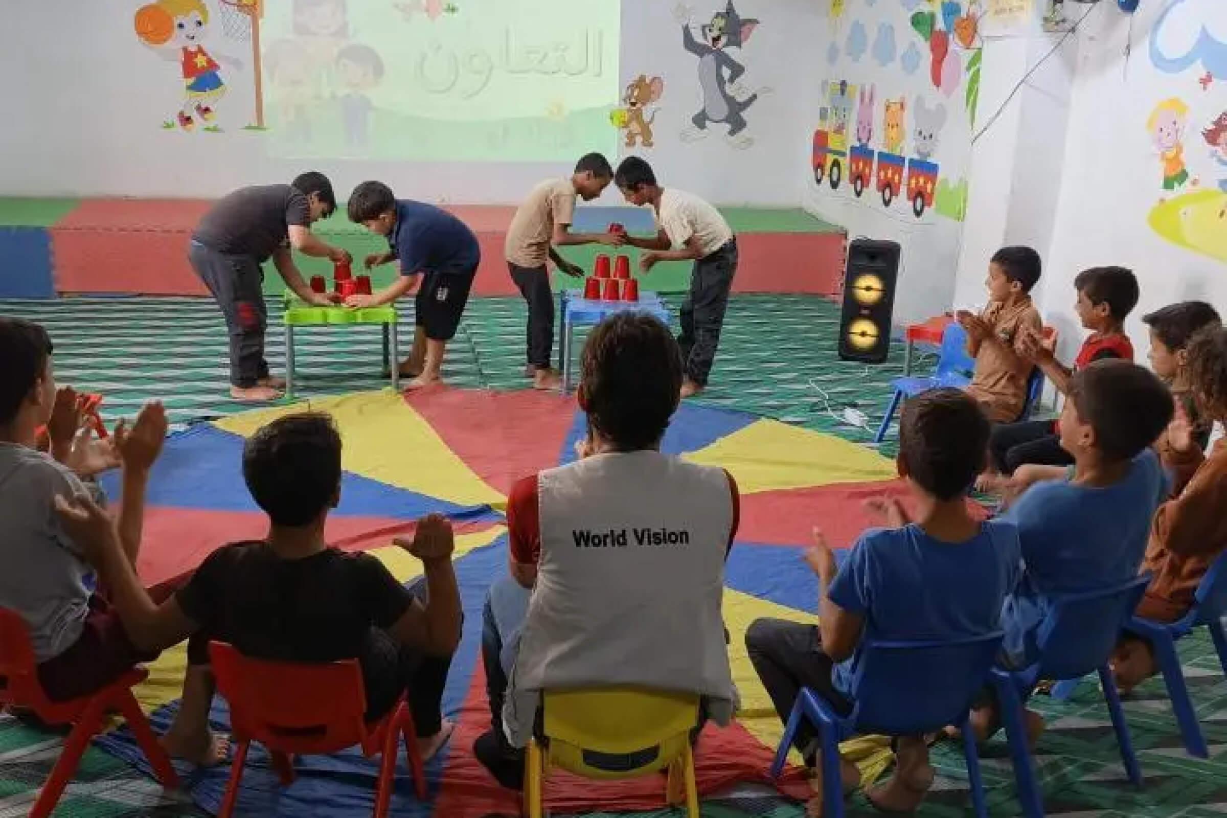 Mahmoud* participating in one of the activities with his friends in Bab Al-Noor center.