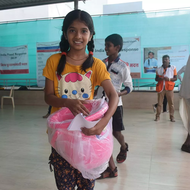 Girl holding a pink bucket